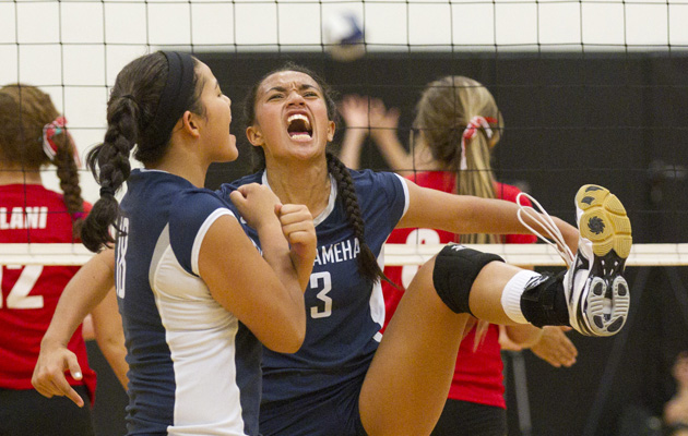 Kamehameha's Tiyana Hallums celebrated a kill against 'Iolani along with teammate Payton Spragling on Sept. 14, 2013. (Cindy Ellen Russell / Star-Advertiser)