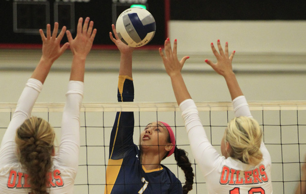 2013 Aug 17 SPT - Punahou's Remo Gaogao hits against Huntington Beach's (L-R) Samantha Brennan and Gianna Guinasso in the championship round of the Ann Kang Volleyball Tournament on Saturday. Honolulu Star-Advertiser Photo by Krystle Marcellus