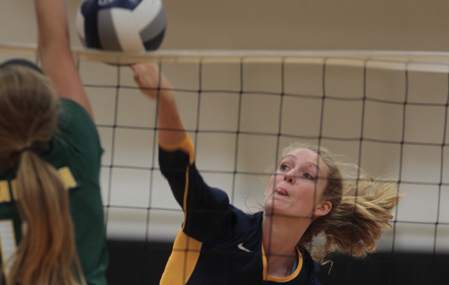 Punahou's Marissa Behrens hit past Mira Costa's Katie Rethmeyer on Aug. 15. (Dennis Oda / Star-Advertiser)