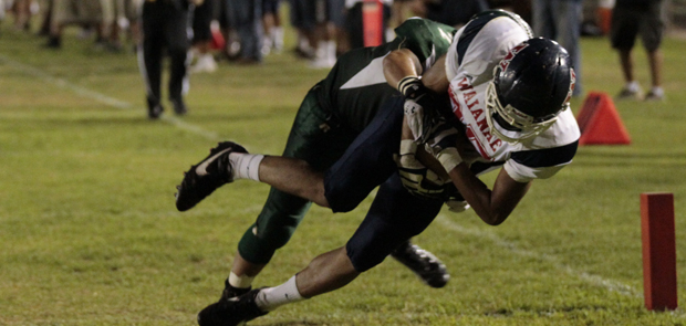 Pookela Noa-Nakamoto dived into the end zone as Aiea's Elijah Tausaga trailed.  (Jamm Aquino/The Honolulu Star-Advertiser)