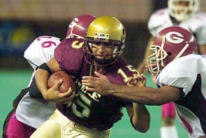 Castle slotback Jared Suzui shook Farrington defenders Taeao Fahalele and Andrew Moi just enough to give the Knights a win and a spot in the OIA championship in 2002. It was the first meeting between Farrington coach Randall Okimoto and Castle's Nelson Maeda. photo by George F. Lee