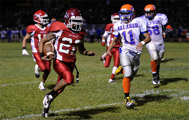 Kalani's Gavin Kim outran Kalaheo defenders in the Falcons' win over the Mustangs last year. Photo by Bruce Asato.