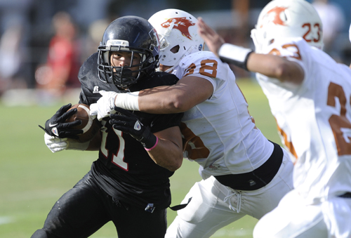 ‘Iolani running back Yuuya Kato's superb performance in relief of an injured teammate in 2012 helped the Raiders capture the 2012 D-II state title. (Bruce Asato / Star-Advertiser)