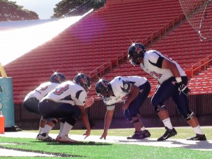 Saint Louis linemen warm up before a game with Pac-Five. (Paul Honda / Star-Advertiser)