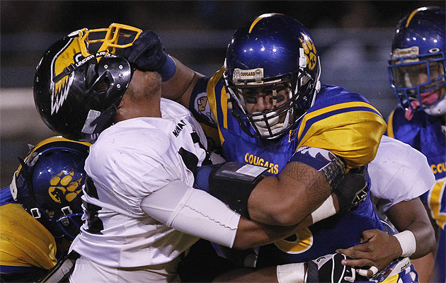 Fitou Fisiiahi knocked Nanakuli's Troy Crawford off of him in a game last year. Photo by FL Morris.