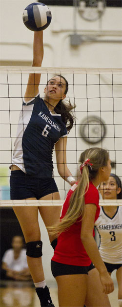 Kamehameha's Kealani Browne rose high above the net to hammer home a kill at 'Iolani on Saturday. Honolulu Star-Advertiser photo by Cindy Ellen Russell.