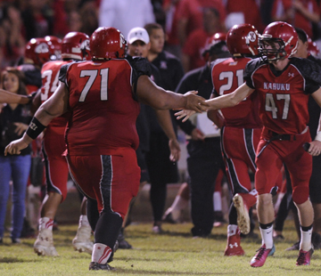 Kahuku's Henry Tonga, left, celebrated with Jacob Samsel after a fumble recovery for a touchdown against Waianae. (Jamm Aquino / Star-Advertiser)