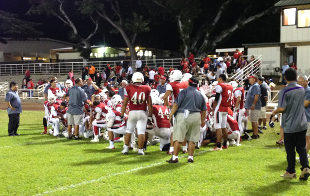 Coach Greg Taguchi talked to his team after Friday night's game. (Brian McInnis / Star-Advertiser)