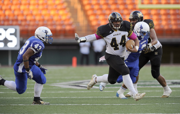 McKinley's Mathias Tuitele-Iafeta carried in the second quarter against Kailua at Aloha Stadium. (Bruce Asato / Star-Advertiser)