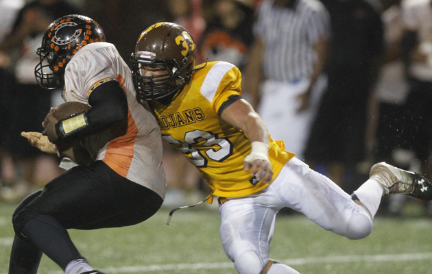 Mililani's Kelii Padello sacked Campbell's Isaac Hurd. (Jamm Aquino / Star-Advertiser)