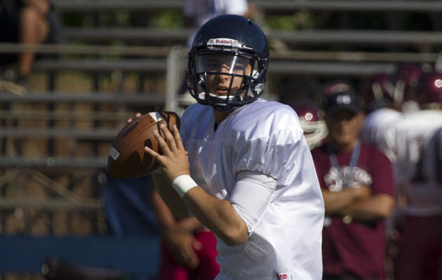 Ryder Kuhns was Saint Louis' starting quarterback as a junior in 2013. He is one of a fabled and productive group of Crusaders QBs throughout the years. Cindy Ellen Russell / Honolulu Star-Advertiser.