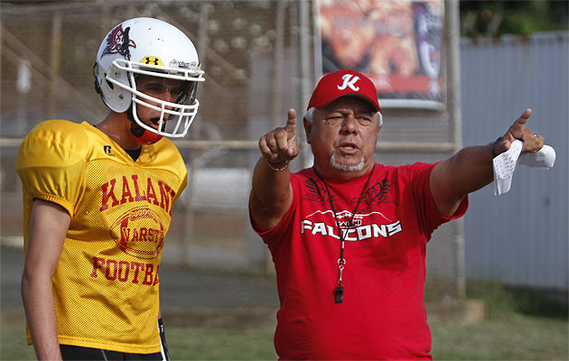 Under the tutelage of quarterbacks coach Howard Peralta, senior Noah Brum has Kalani playing in its first-ever playoff game. PHOTO BY DENNIS ODA.