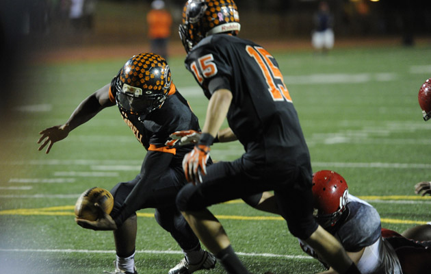 Campbell QB Isaac Hurd lunged for the end zone in the OIA playoffs against Kahuku. (Bruce Asato / Star-Advertiser)