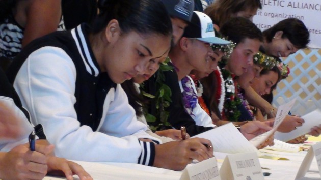 Aloha Robins-Hardy, shown signing a letter of intent to play basketball and volleyball for BYU, is one of Kamehameha's top players. (Paul Honda / Star-Advertiser)