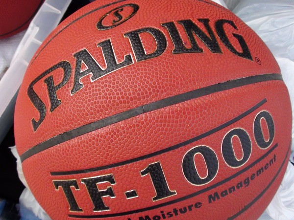 The Spalding TF-1000, a light basketball with a bit of a red tint, is no longer the official ball of the OIA and HHSAA. (Paul Honda / Star-Advertiser)