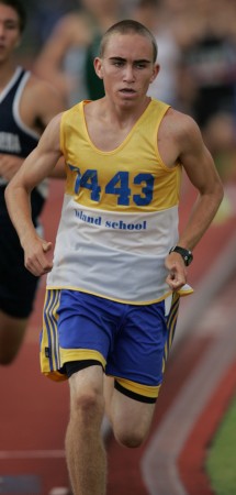 Island School's Pierce Murphy holds the state meet record in the 3,000 meters. Photo by FL Morris.