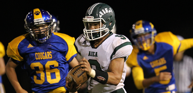Aiea's Kody Ongory-Mathias ran for a first down against Kaiser on Aug. 15. (Darryl Oumi / Special to the Star-Advertiser)