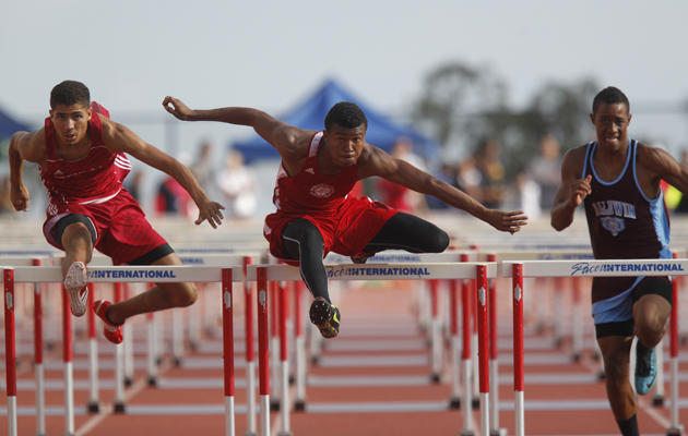 Lahainaluna's Emerson Liburd, middle, competed with Kalani's Raymond Alves, left, and Baldwin's Anthony Kahoohanohano in the boys 110-meter hurdles.