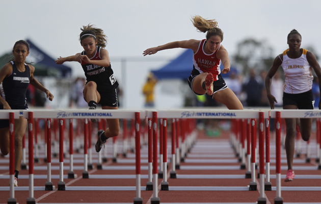 Hawaii Prep Academy's Emma Taylor, second from right, led the way during the girls 100-meter hurdles.