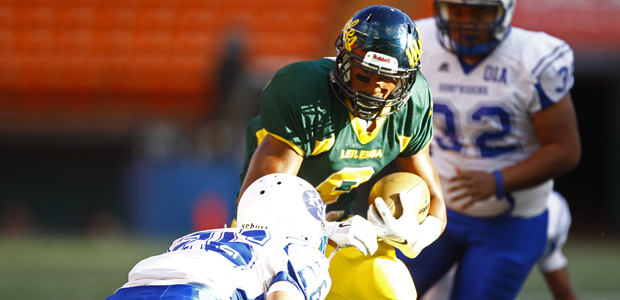 Leilehua's Randy Neverson tried to get around Kailua's Matthew Gaspar on Aug. 16. (Jamm Aquino / jaquino@staradvertiser.com).