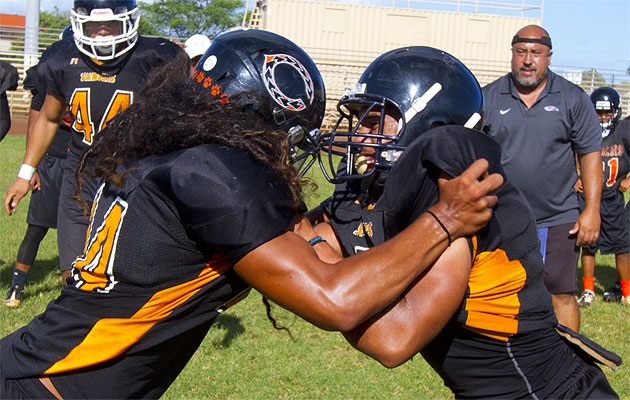 Defensive back Solomon Matautia, left, is the latest Saber to be judged as one of the best in the state at his position. Photo by Dennis Oda.