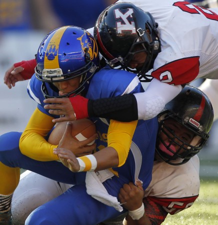 With linebacker Kelii Efhan, top, on the field, the cupboard is far from bare at Kauai. Jamm Aquino/The Honolulu Star-Advertiser