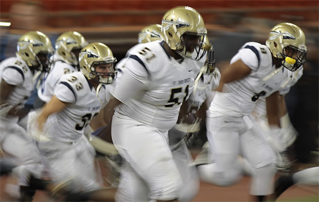 The St. John Bosco Braves ran onto the field prior to beating Saint Louis. Honolulu Star-Advertiser/Jamm Aquino