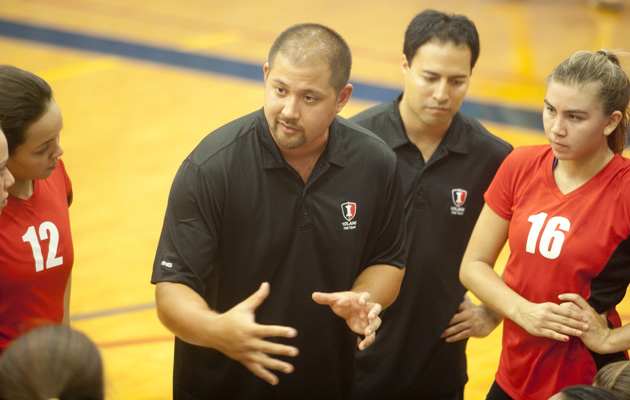 Iolani coach Kainoa Obrey talked with his team during a Sept. 17 game against Punahou. (Kat Wade / Special to the Star-Advertiser)
