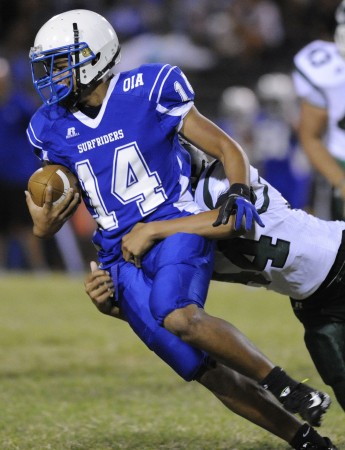 Aiea's Solomona Agasiva dropped Kailua's Martin Tigilau for a loss in the second quarter on Saturday. HSA photo by Bruce Asato