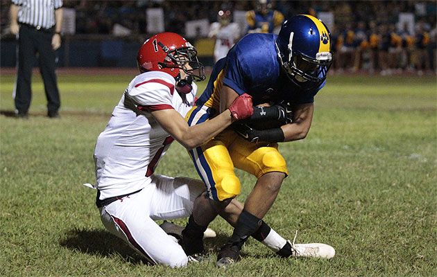 Kaiser's Cody Kim intercepted a pass intended for Kahuku's Chance Maghanoy on Friday. Honolulu Star-Advertiser photo by Krystle Marcellus