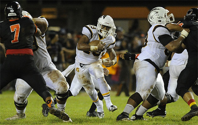 Mililani's Vavae Malepeai benefited from a huge hole by his blockers in a win over Campbell on Friday. Bruce Asato/Star-Advertiser. 