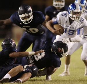 It is usually over for a ballcarrier once Waianae's Jaylen Gonzales (No. 8) gets his mitts on one. Honolulu Star-Advertiser photo by Krystle Marcellus