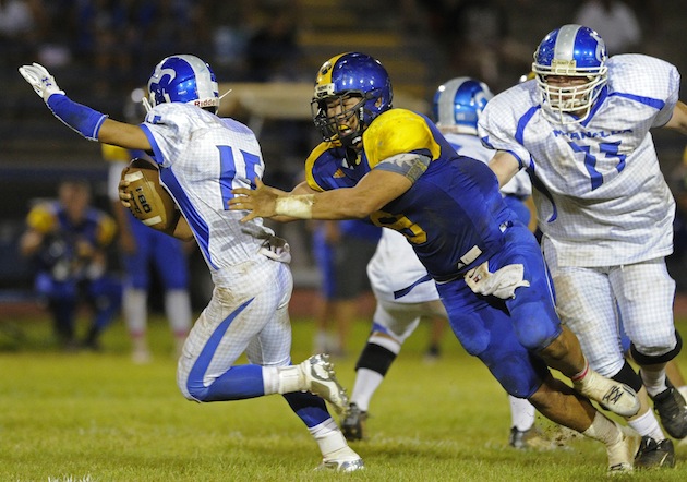 Kaiser DL Zeno Choi had two sacks against Moanalua. Now he has to figure out how to slow down Mililani. Photo by Bruce Asato/Star-Advertiser