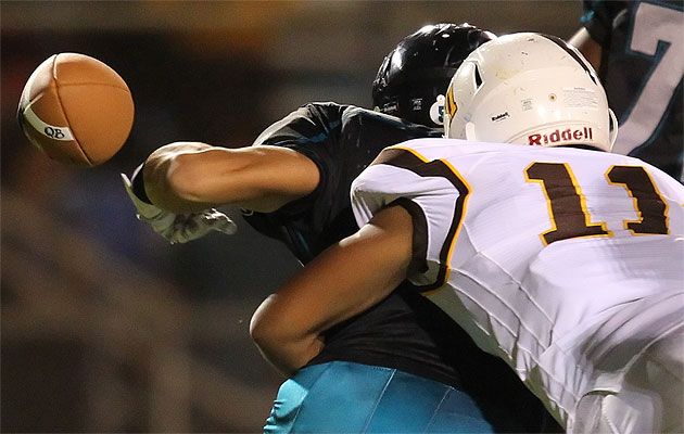 Mililani linebacker Palaie Gaoteote  forced Kapolei running back Ronald Young to fumble the ball earlier this year. Darryl Oumi / Special to the Star-Advertiser.