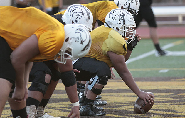Mililani's offensive line went hard on Wednesday to prepare for Kahuku. Krystle Marcellus / Star-Advertiser 