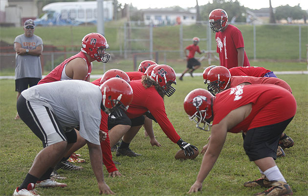 Kahuku intends to line up its big boys and punch Punahou in the mouth on Saturday. Krystle Marcellus / Star-Advertiser