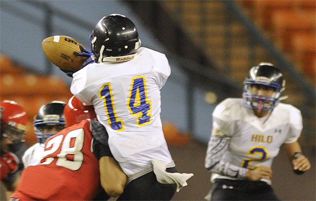 A pass intended for Hilo's Nainoa Kawailima Kahuku's was broken up by Kahuku's Braxton Medeiros in the first round of the Division I state tournament last year. Hilo coach David Baldwin was placed on indefinite leave on Monday, less than a week before the Vikings' season opener on Saturday at Punahou. Bruce Asato / Honolulu Star-Advertiser.