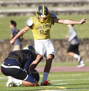 Being the hero of Saturday's game doesn't preclude Punahou kicker Jet Toner from getting his work in. Jamm Aquino / Star-Advertiser
