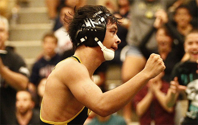 Mililani's Zack Diamond pumps his fist after beating Pearl City's Baylen Cooper in the boys 138-pound title match. Jamm Aquino / Star-Advertiser