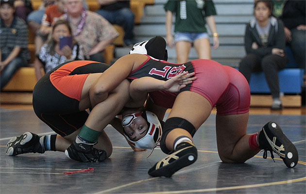 Campbell's Angela Peralta looked for a way out of a hold applied by Lahainaluna's Carly Jaramillo on Saturday. Honolulu Star-Advertiser photo by Krystle Marcellus  