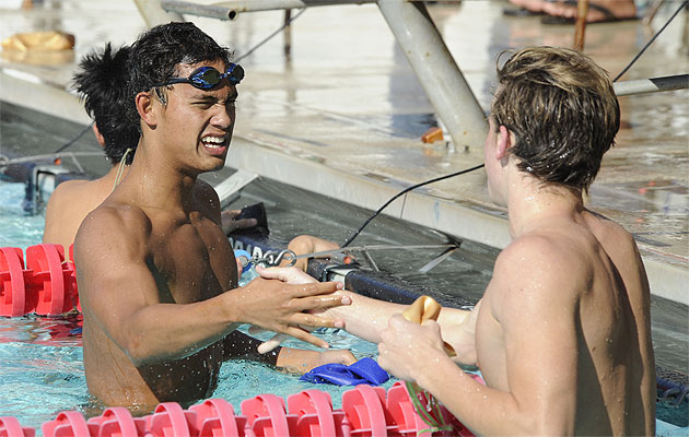 Kamehameha's Kanoa Kaleoaloha, left, shakes hands with Punahou's Sam Sutherland. Bruce Asato / Star-Advertiser