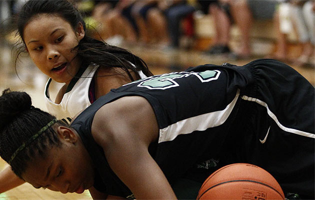 St. Mary's Ariel Johnson secured a loose ball from Konawaena's Mikayla Tablit during the first half of the 2014 Iolani Classic. Jamm Aquino / Star-Advertiser