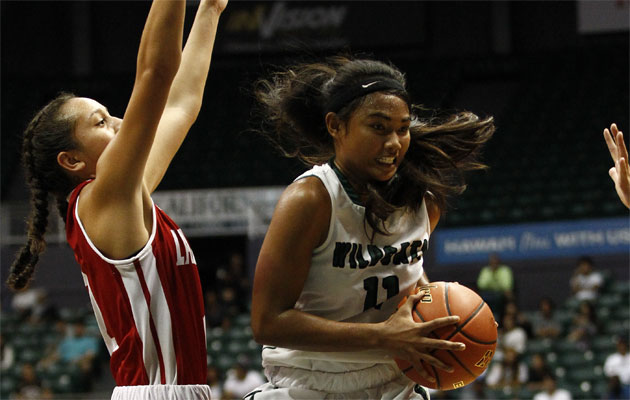 Konawaena's Chanelle Molina drives past Lahainaluna's Fe-Ko-Fiemea Hafoka during the second half.  (Jamm Aquino/Honolulu Star-Advertiser).