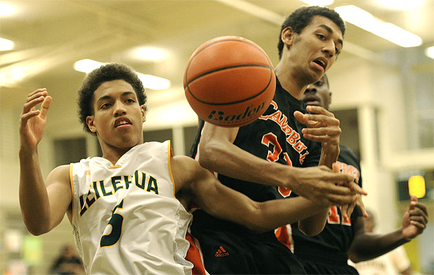 Leilehua's Joseph Gouty (5) and Campbell's David Marrero chased down a loose ball on Friday. Bruce Asato / Star-Advertiser