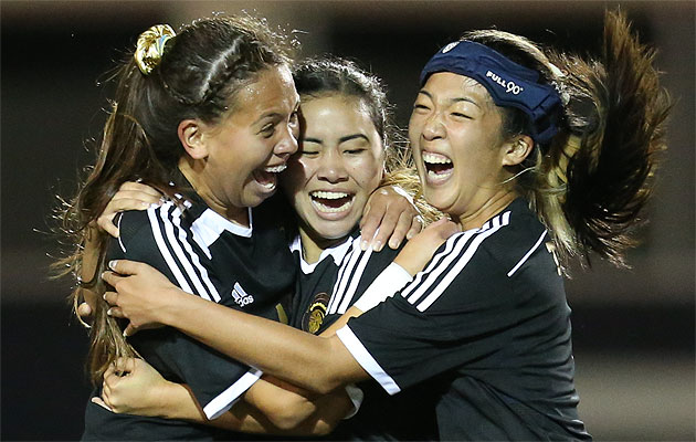 The Trojans celebrate a goal in a win over Punahou. Darryl Oumi / Special to the Star-Advertiser