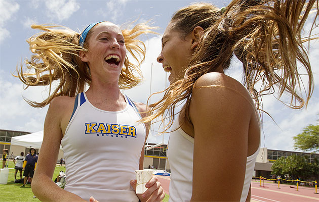 Kaiser's Kristen O'Handley and Celine Lum, right, celebrated a relay win at the Punahou relays. A week later, Lum broke the OIA pole vault record. Cindy Ellen Russell / Star-Advertiser