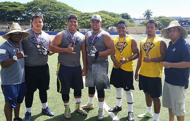 Blue-Grey All-American Bowl organizers, left and right, flank five Hawaii players who have been invited to play in the all-star game in December in Arlington, Texas. The five are Saint Louis' Nate Herbig, Kaiser's Michael Eletise, Kapolei's Sean Auwae, Mililani's Vavae Malepeai and Farrington's Jeremiah Pritchard. The photo was taken during a Blue-Grey combine at Saint Louis School in March. Photo courtesy of Keiki Misipeka