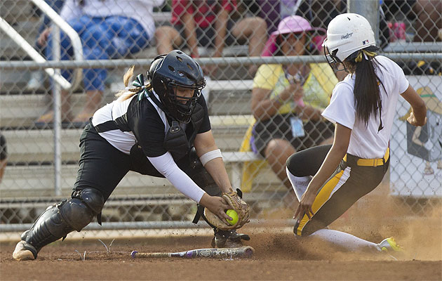 Nanakuli's Cheyenne Lute tried to avoid Aiea catcher Kaile Alama's tage in a game earlier this year. The Golden Hawks and Na Alii will play for the state title on Friday. Cindy Ellen Russell / Star-Advertiser