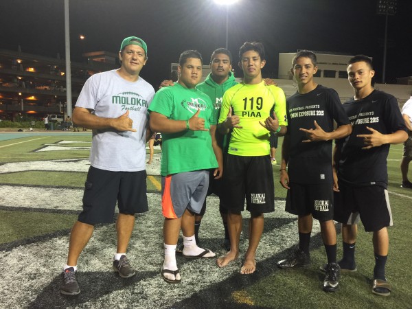Molokai brought nine players, including the players in this photo with coach Mike Kahale. 