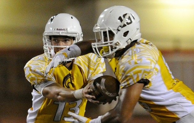 Mililani's McKenzie Milton and Vavae Malepeai played big parts in Saturday's record-breaking game. Photo by Bruce Asato/Star-Advertiser.